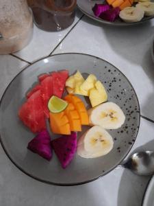 a plate of sliced fruit on a table at Pondok Kukuh villa Sidemen in Sidemen