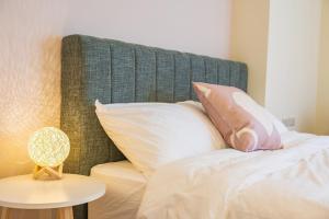 Een bed of bedden in een kamer bij 悠日 Lazy Days 澎湖民宿