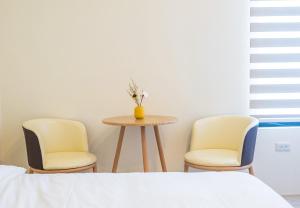 Een bed of bedden in een kamer bij 悠日 Lazy Days 澎湖民宿