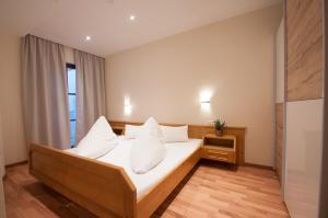 Postel nebo postele na pokoji v ubytování Apartmenthaus ROSE