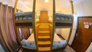 a room with two bunk beds and a staircase at Thamel Hotel & Spa in Kathmandu