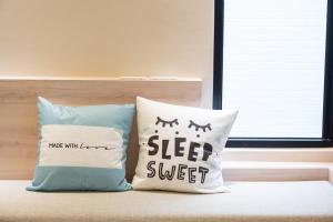 Een bed of bedden in een kamer bij 悠日 Lazy Days 澎湖民宿