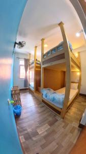 a room with two bunk beds in a house at Thamel Hotel & Spa in Kathmandu