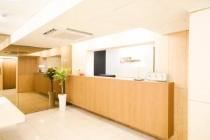 a lobby with a reception desk in a building at SimpleStay Hotel in Jongno in Seoul