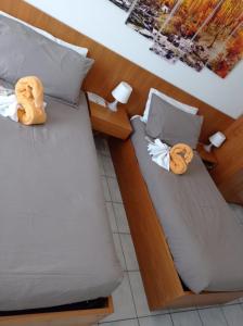 Ένα ή περισσότερα κρεβάτια σε δωμάτιο στο Hotel Ristorante Camoghe