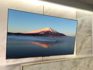 a framed picture of a mountain on a wall at Hotel Rocks in Tokyo