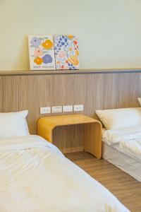 Een bed of bedden in een kamer bij 悠日 Lazy Days 澎湖民宿