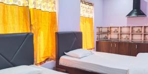 Postel nebo postele na pokoji v ubytování HOTEL PURI GREENS + 37 fotografií