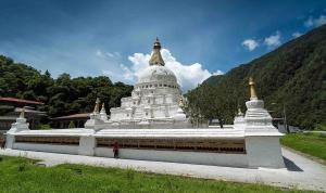 a large white building with a dome on top of it at Manaslu Homestay in Kathmandu