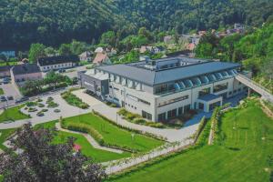 an aerial view of a large building with a garden at Nuhr Medical - Hotel & Restaurant in Senftenberg