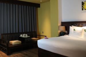 Postel nebo postele na pokoji v ubytování Cochin Sang Hotel