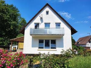 a white house with a gambrel roof at Muhrbach in Ottersweier