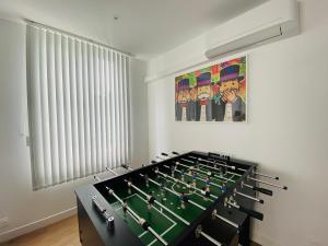 a room with a poker table and chairs in it at La Capsule de l’Impasse in Limoges +7 photos