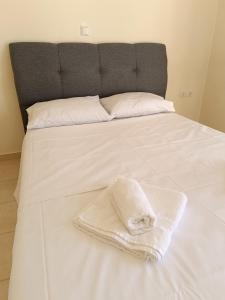 En eller flere senge i et værelse på Villa Maria