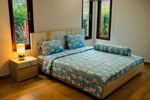 Llit o llits en una habitació de Spacious House In Hatyai