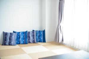 A bed or beds in a room at Suikouen Hotel