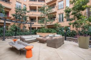 a patio with furniture in front of a building at Playa del Rey 1BR w Gym WD Pool nr LAX Beach LAX-147 in Los Angeles