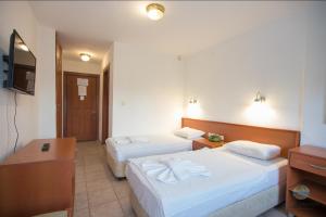 A bed or beds in a room at Private Hotel