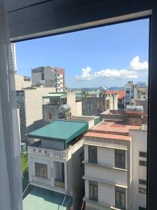 a view of a city from a window at Bảo Sơn Hotel in Ha Long