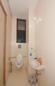 a bathroom with a toilet and a sink at Garava Villa Lonavala in Khandala