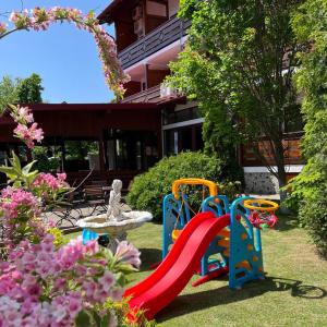 a playground in the yard of a house at Casa Luca in Vama Veche