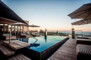 a swimming pool with a view of the ocean at Southern Sun Hyde Park Sandton in Johannesburg