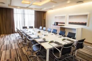 a large conference room with a long table and chairs at Southern Sun Hyde Park Sandton in Johannesburg