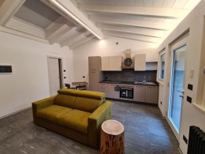 a living room with a couch and a table at Cà Marinet 1931 - Tresivio - Sondrio in Tresivio
