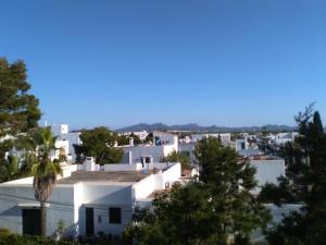 a view of a town with white houses and trees at Home D'or in Cala d´Or
