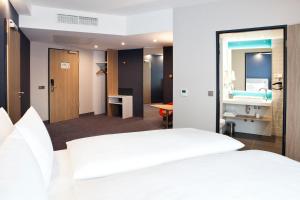 Postel nebo postele na pokoji v ubytování Holiday Inn Express Bochum by IHG