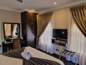 Μια τηλεόραση ή/και κέντρο ψυχαγωγίας στο Glen Marion Guest House
