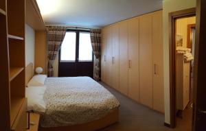 Cama o camas de una habitación en Residence Dei Walser