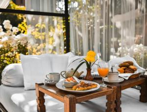 a table with a tray of food and drinks on it at The Dwarika's Hotel in Kathmandu +28 photos