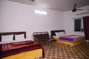 Krevet ili kreveti u jedinici u okviru objekta Chang Ghar Resort