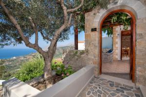 a stone house with a view at Stefanos Village Hotel in Plakias
