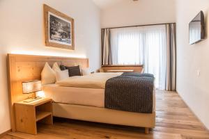 Ένα ή περισσότερα κρεβάτια σε δωμάτιο στο Hotel Sarain Active Mountain Resort