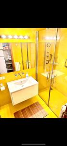 a bathroom with a sink and a shower at Corso Garibaldi Suite in Milan