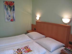 Krevet ili kreveti u jedinici u okviru objekta Hotel Garni Höchschmied