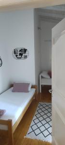 Postel nebo postele na pokoji v ubytování Hotel & Rooms Lombrelle