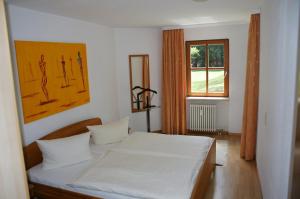 Postel nebo postele na pokoji v ubytování Appartements am Park