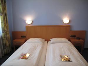 Krevet ili kreveti u jedinici u okviru objekta Hotel Garni Höchschmied