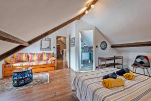 a bedroom with a bed and a living room at KerMad - Maison avec jardin in Le Relecq-Kerhuon