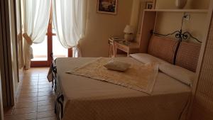 Ein Bett oder Betten in einem Zimmer der Unterkunft Hotel Gallo Nero