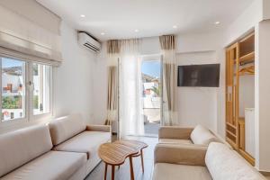 Телевизор и/или развлекательный центр в Hotel Benois