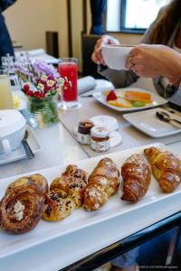 a table with a plate of pastries on it at LHP Hotel Montecatini Palace & SPA in Montecatini Terme