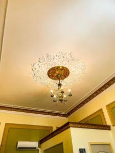 a chandelier on the ceiling of a room at Hotel Boutique Casa Vermont in Bucharest