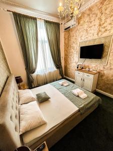 TV a/nebo společenská místnost v ubytování Hotel Boutique Casa Vermont