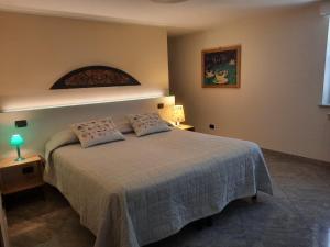 Postel nebo postele na pokoji v ubytování b&b Al Castel
