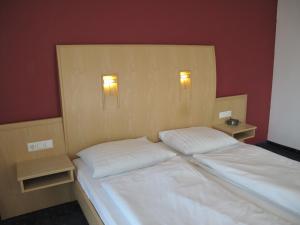 Krevet ili kreveti u jedinici u okviru objekta Hotel Garni Höchschmied