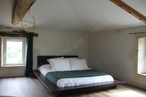 Postel nebo postele na pokoji v ubytování Les Chambres des Ardillers